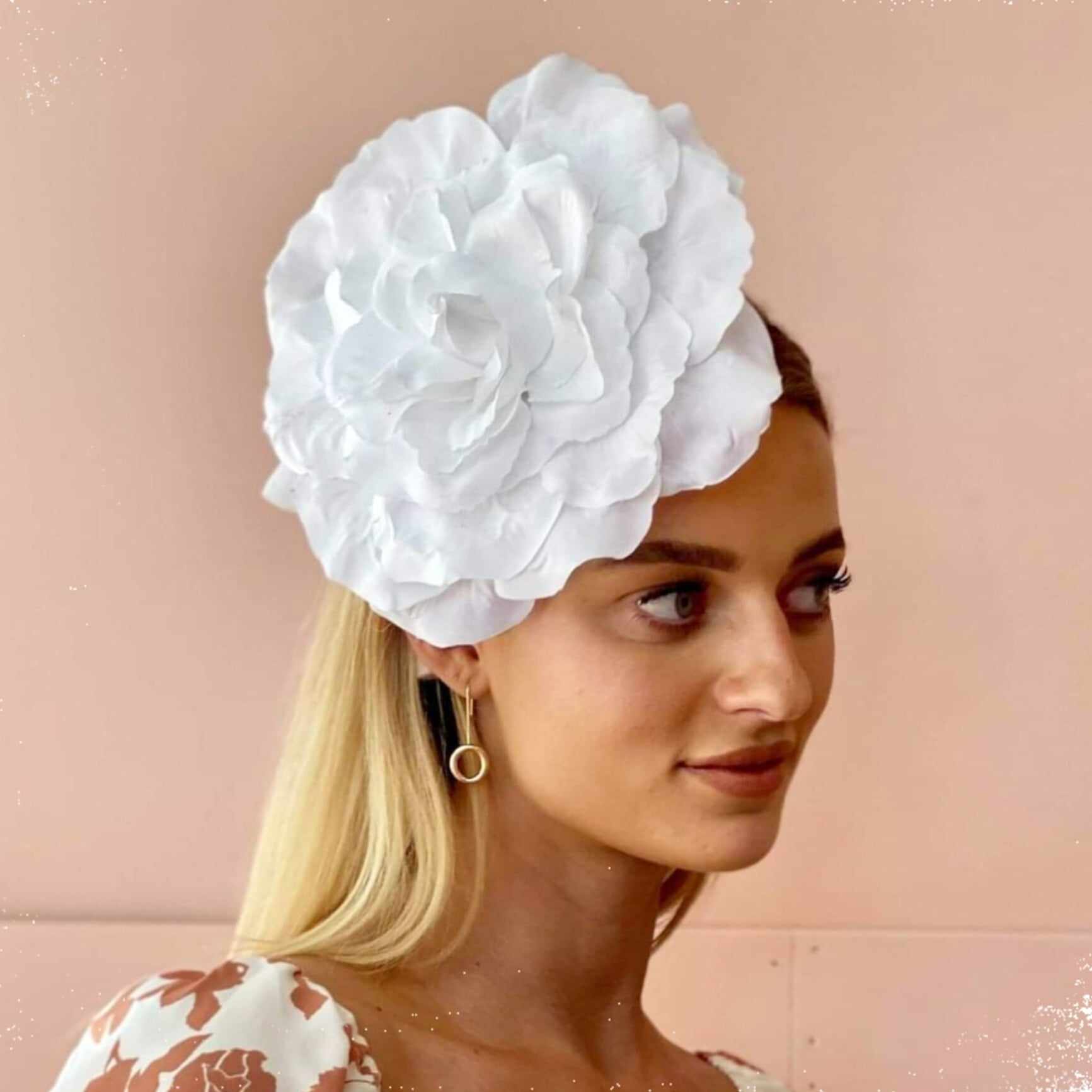 a classic white single flower headpiece for the races