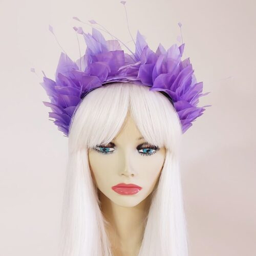 a beautiful feather crown in lilac purple