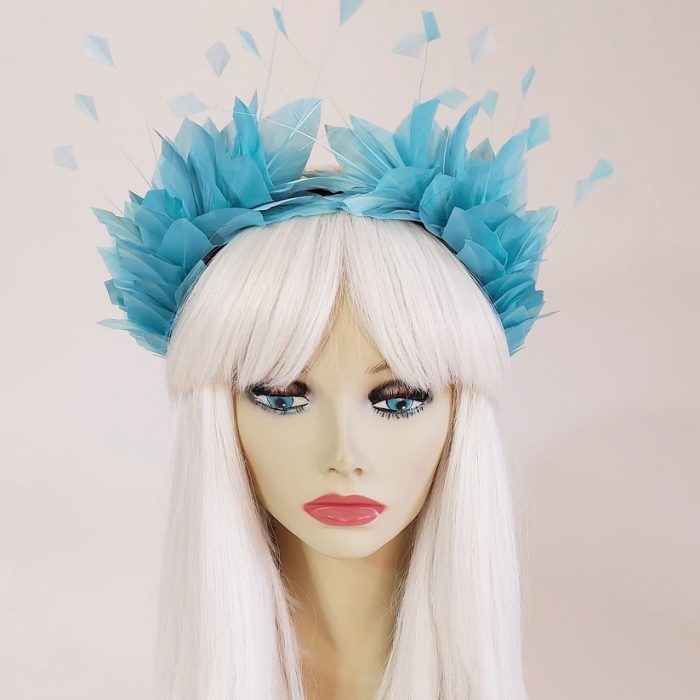 a beautiful soft blue feather headpiece for the races