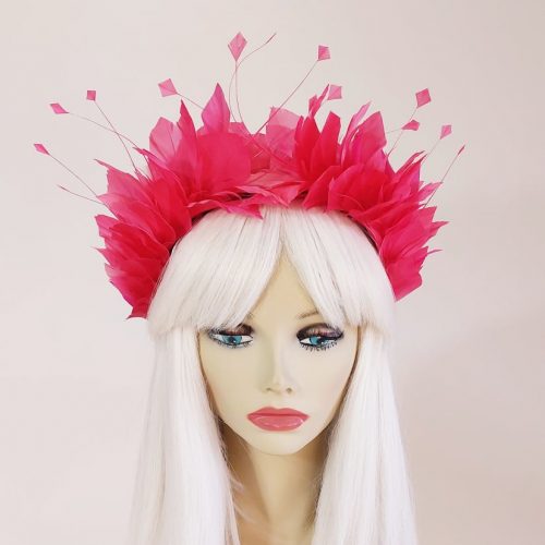 a beautiful feather headpiece in fuchsia pink