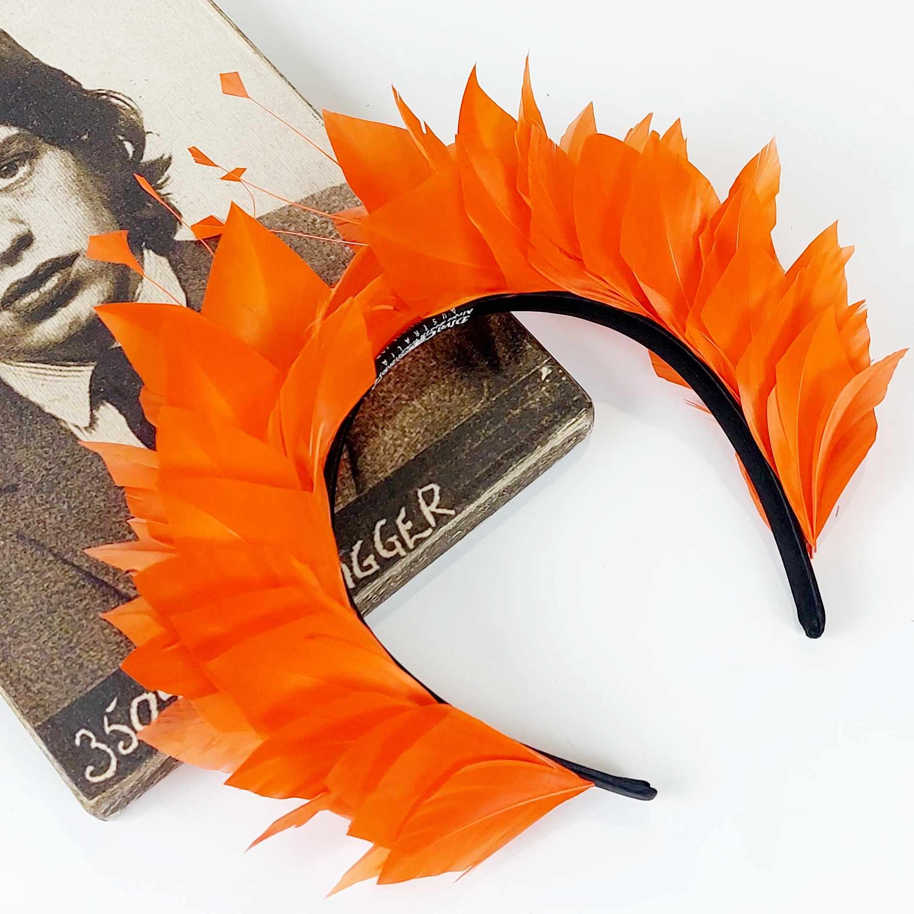 orange feather fascinator crown for the races