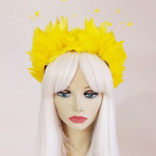 a stunning yellow flower headpiece for the races