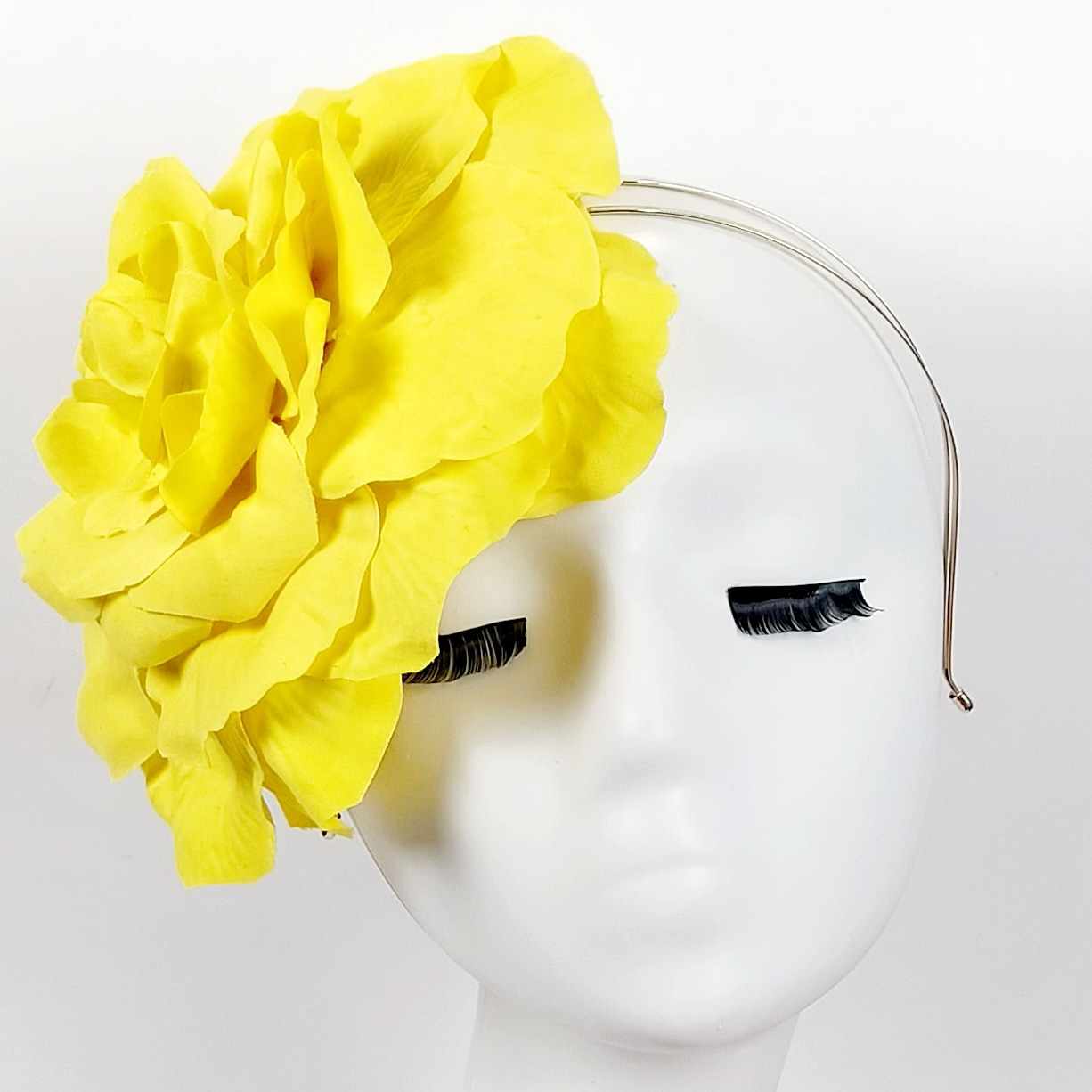 single oversized large yellow flower fascinator headpiece wear to the race