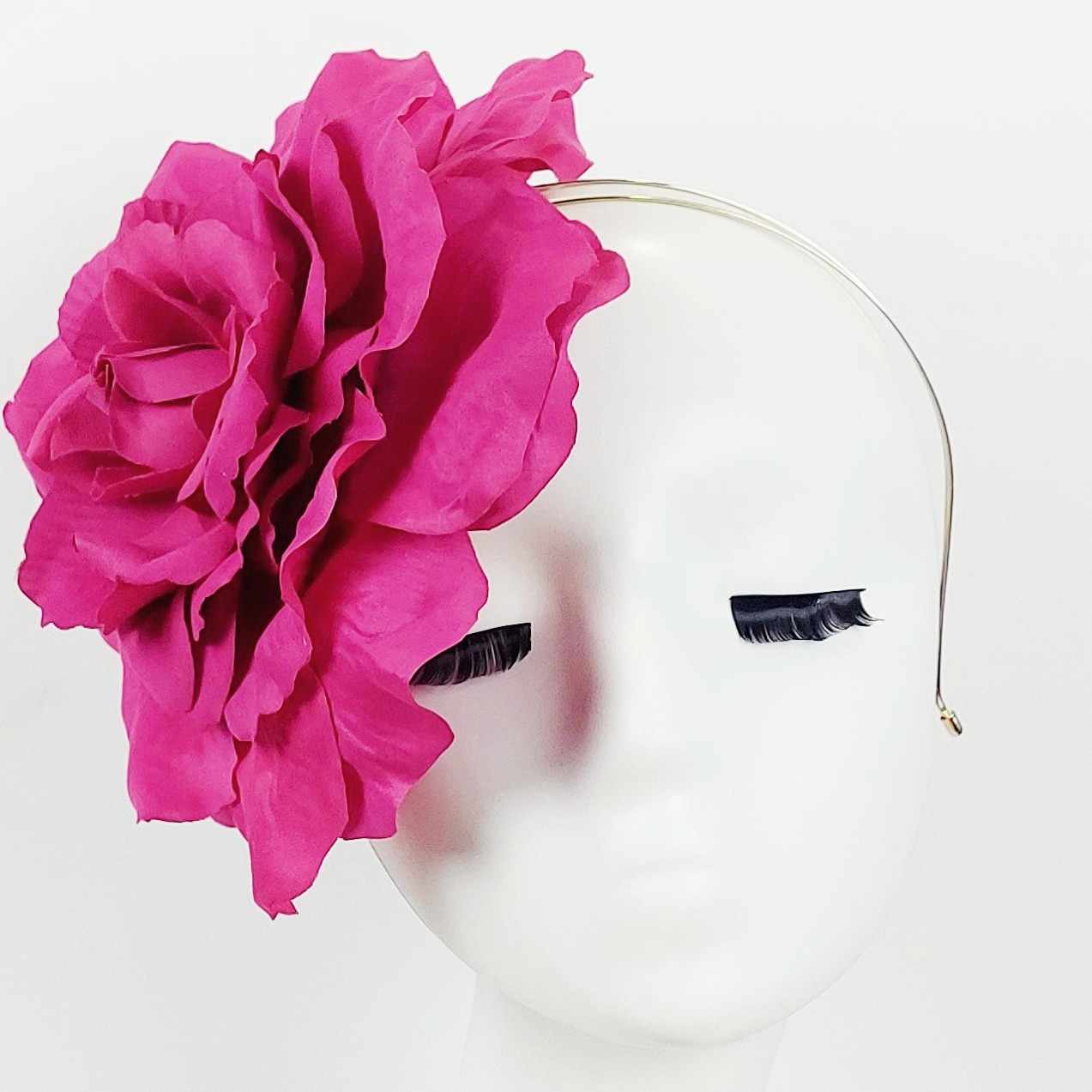 single oversized large magenta pink flower fascinator headpiece wear to the races