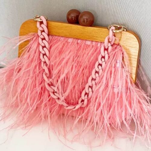 wooden frame feather handbag that oozes retro vibes in flamingo pink